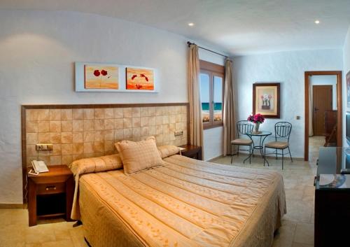 Postel nebo postele na pokoji v ubytování Hotel Antonio
