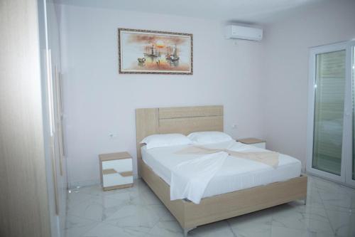a bedroom with a bed with a bow on it at Miri House in Domje