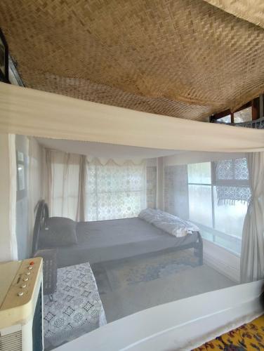 a bedroom with a bunk bed and a window at Slove U House in Khon Kaen