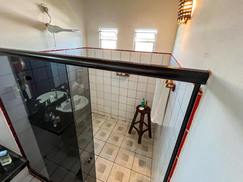 a bathroom with a shower and a sink at Loft NOA'House in Canoa Quebrada