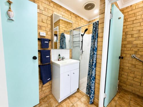 a bathroom with a sink and a shower at Champion Bay Coastal Stay in Geraldton