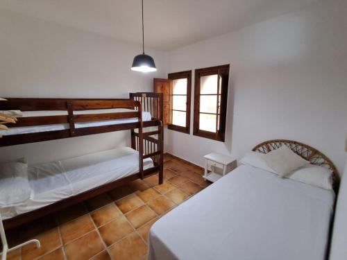 a bedroom with two bunk beds and a bed at Dar YLA in Tétouan