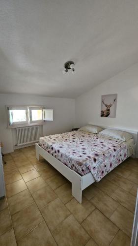 a bedroom with a large bed in a room at Nonna Marisa B&B in Madonna di Fornelli