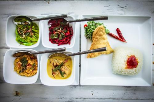 a lunch box with different types of food on it at W15 Escape in Ahangama