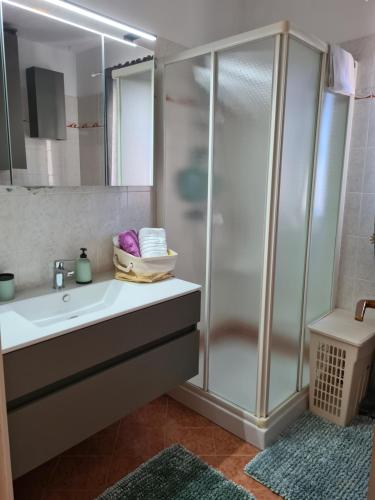 a bathroom with a shower and a sink at Lovely apartment Branko Rabac with balcony and parking in Rabac