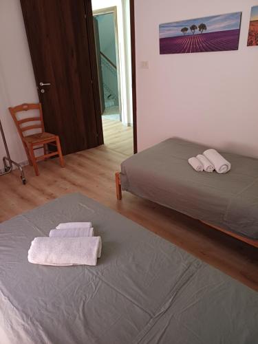 a bedroom with a bed and two towels on it at Villa Alma in Bari