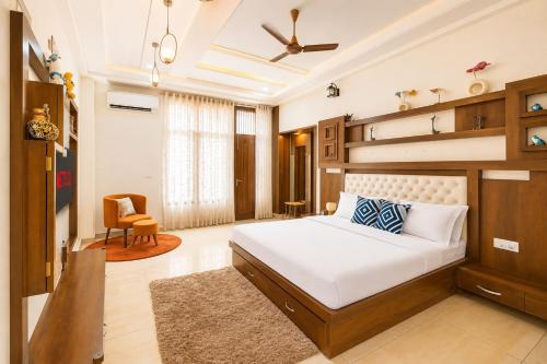 a bedroom with a bed and a chair at Entire 3BHK Villa for Families & Groups with Kids Play Area in Jaipur