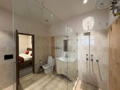 a bathroom with a sink toilet and a shower at Hotel Bella Vento Luxury Stay Near CGC Landran Mohali Chandigarh in Kharar