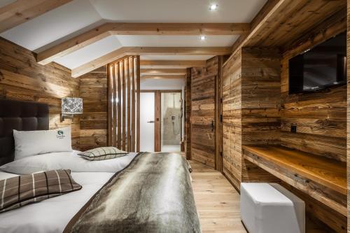 Ένα ή περισσότερα κρεβάτια σε δωμάτιο στο Liondes Chalets