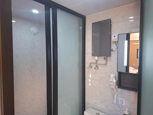 a bathroom with a shower with a sink and a mirror at FALCOARIA Eco in Setúbal