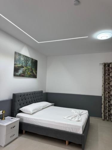 a bedroom with a bed in a room at Vila Topi in Vlorë