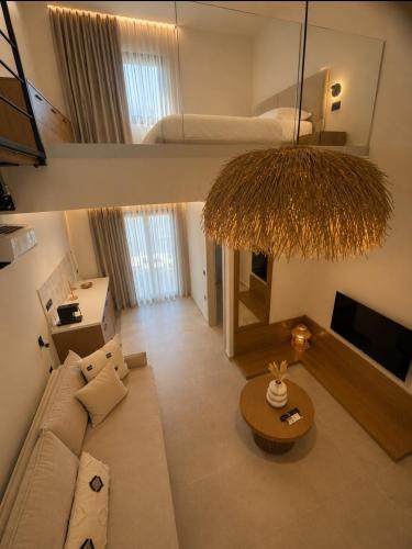 a living room with a couch and a bed at Estia Luxury Suites & Spa in Platamonas