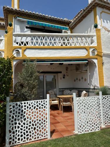a white fence in front of a house at Casa Costa del Sol Beach&Golf,Marbella in Sitio de Calahonda