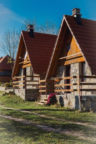 a log cabin with a brown roof at IMANJE JELEN in Nikšić