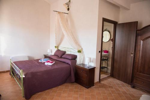 Giường trong phòng chung tại Il Casaletto del Terminillo