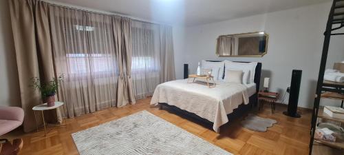 a bedroom with a bed and a television in a room at aNNa s Cozy Home with Private Forest, Canopy Terrace & Parking, near Red Bull Ring in Sankt Michael in Obersteiermark
