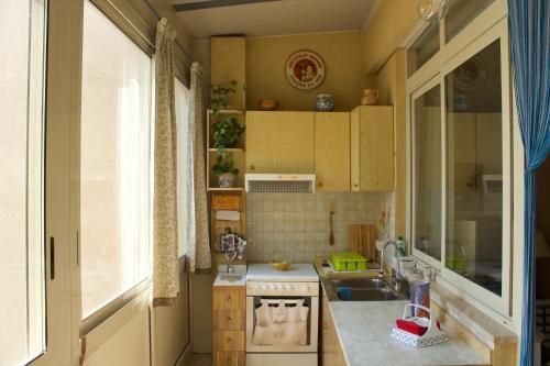 a small kitchen with a sink and a window at Casa Arcobaleno in Marsala