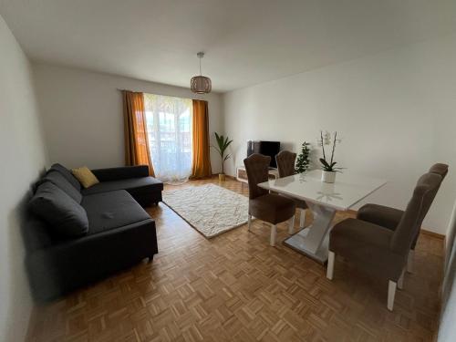 a living room with a couch and a table at Apartment in Stäfa in Stäfa