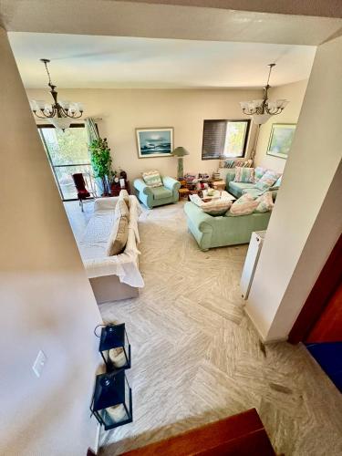 an overhead view of a living room with couches at Villa w Studio, Pool, Garden, Sleeps 12 to 15 in Rákhai