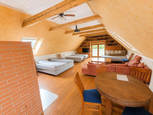 a large living room with a brick wall at Kalvi tee Puhkemaja in Viru-Nigula