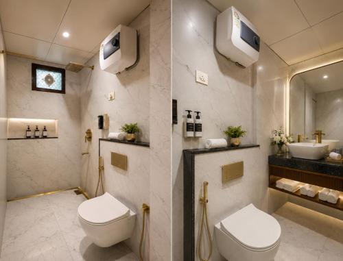 a bathroom with a toilet and a sink at Hotel Marina Premium Near IGI Airport Delhi in New Delhi
