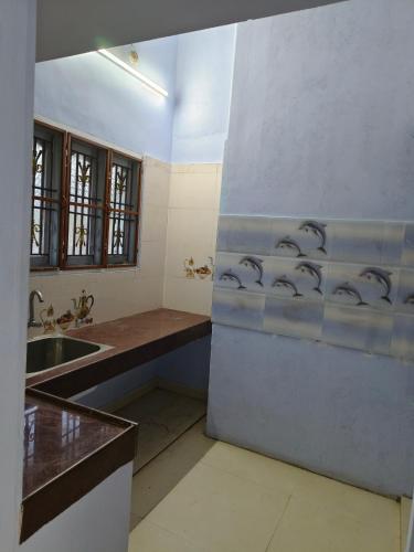 a bathroom with a sink and a counter top at SM GARDENS Nature Stay Kodaikanal in Oothu