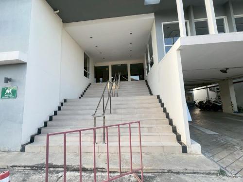 a set of stairs leading to a building at The Patio Bangsaen Cozy Condo in Chon Buri