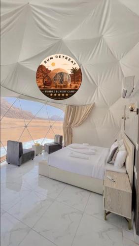 a bedroom with a bed and a sign in a tent at camp sand in Disah