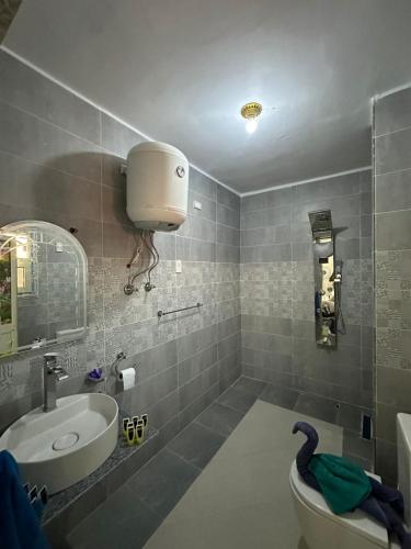 a bathroom with a sink and a toilet and a bath tub at 3pyramids view inn in Cairo