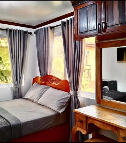 a small bedroom with a bed and a window at Noah Bed&Breakfast 3 Private Room NEWHOME Quiet Place to Stay 14 Minutes to PPS Airport in Puerto Princesa City