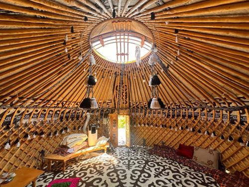 a room with a large yurt with a window at Yurt guesthouse in Osh