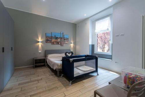 a bedroom with a bed and a window at Sun Bologna in Bologna