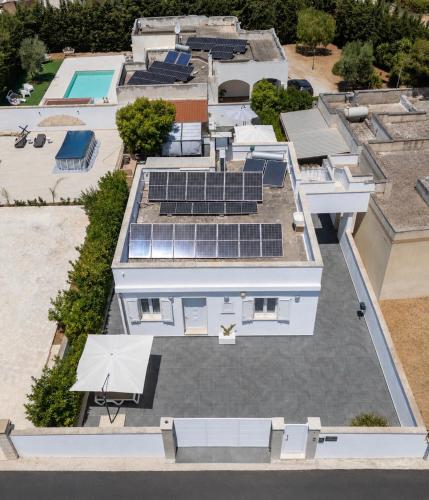 an aerial view of a house with solar panels on the roof at Lu Chiapparu B&B in Nardò