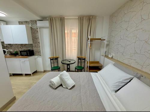 a bedroom with a bed with two pillows on it at Alteagroup Joy in Altea