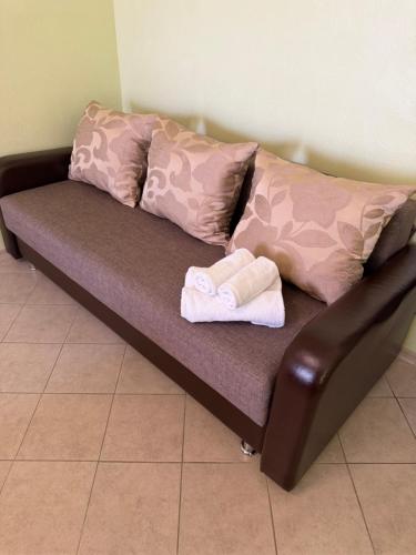 a couch with two towels on top of it at Hotel Olimp in Zatoka
