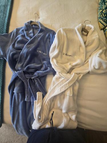 a pile of clothes sitting on top of a couch at St Michaels Guest House in Elgin
