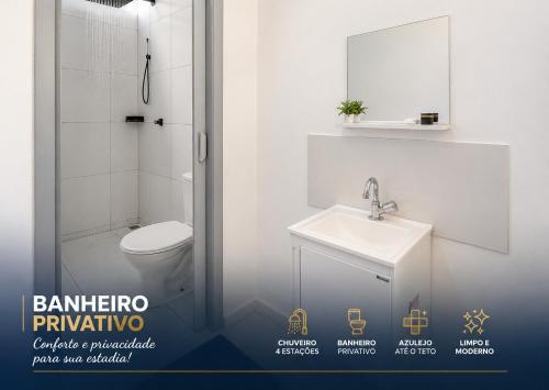 a bathroom with a toilet and a sink and a shower at Apartamentos-6-3-8 - Pousada Itapetininga in Itapetininga