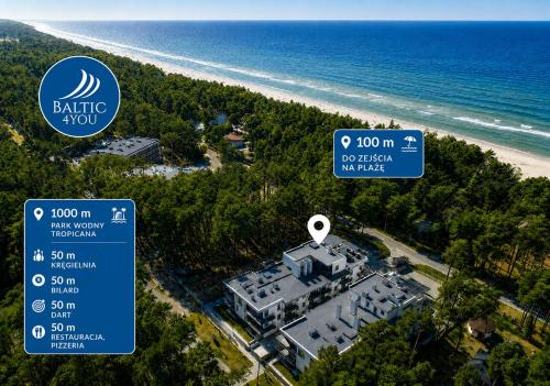 an aerial view of a building next to the beach at Baltic 4YOU in Pobierowo