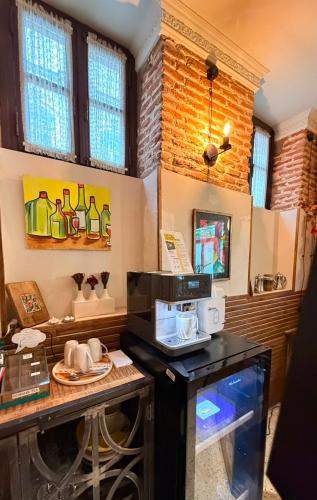 a kitchen with a counter with a microwave on it at Arts Hotel Tbilisi in Tbilisi City