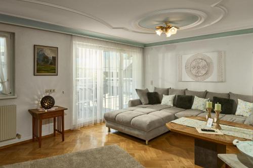 a living room with a couch and a table at Haus Bergharmonie in Tschagguns