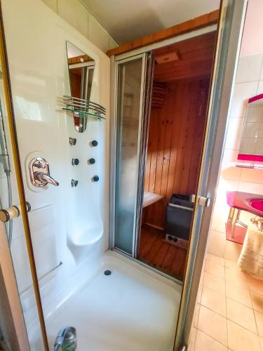 a shower with a glass door in a bathroom at Hotel Rimski Most in Sarajevo