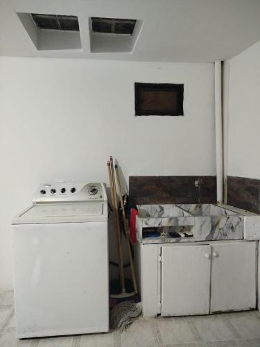 a kitchen with a stove and a counter top at DESTINY Apto Parque in San Rafael