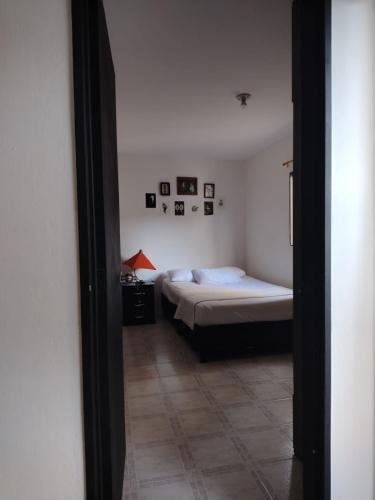 a bedroom with a bed and a bed sidx sidx sidx sidx sidx at DESTINY Apto Parque in San Rafael