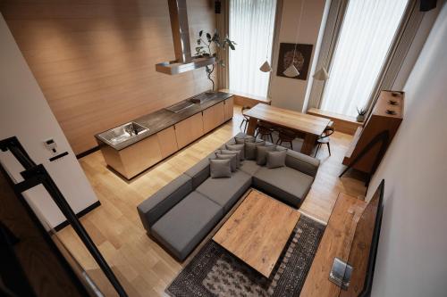 an overhead view of a living room with a couch and a table at TRUNK(HOTEL)CAT STREET in Tokyo