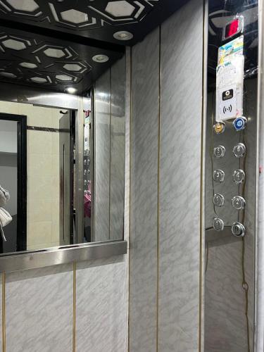 a wall with a mirror in a bathroom at la corniche de tanger in Tangier