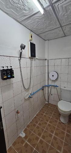 a bathroom with a toilet and a shower at Ao Nang Room And Bike 10 in Ao Nang 