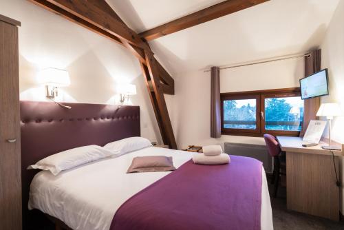 Ένα ή περισσότερα κρεβάτια σε δωμάτιο στο La Villa Borgo