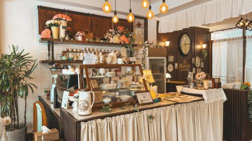 a store with a counter filled with lots of items at LA BURIE HOTEL Chiang Mai in Chiang Mai