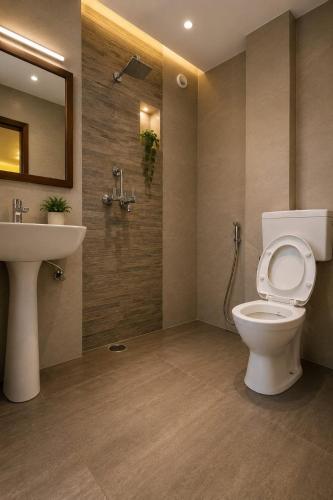 a bathroom with a toilet and a sink at Rumis Jaisalmer in Jaisalmer