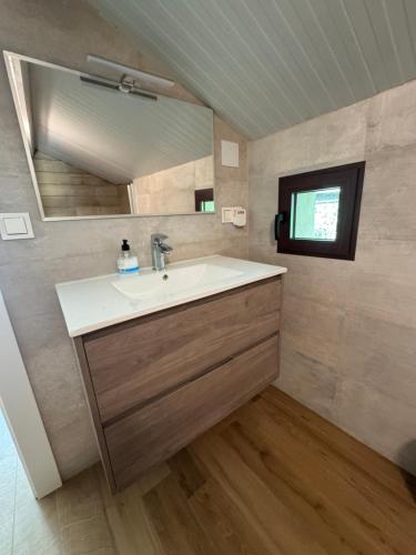 a bathroom with a sink and a mirror at Finca El Carrascal Arroyo frío, Sierra de Cazorla in Arroyo Frio